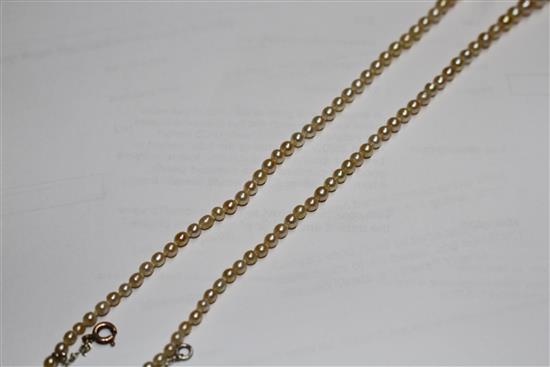 A single strand graduated natural pearl necklace, with old cut diamond cluster set yellow metal clasp.